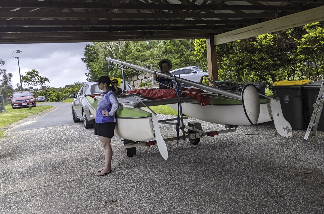A photo of the boat on the trailer behind our silver corolla under our carport. Sam is sitting on the boat, Michelle is standing to the left and Alex is visible in the background. A photo of the boat on the trailer behind our silver corolla under our carport. Sam is sitting on the boat, Michelle is standing to the left and Alex is visible in the background.