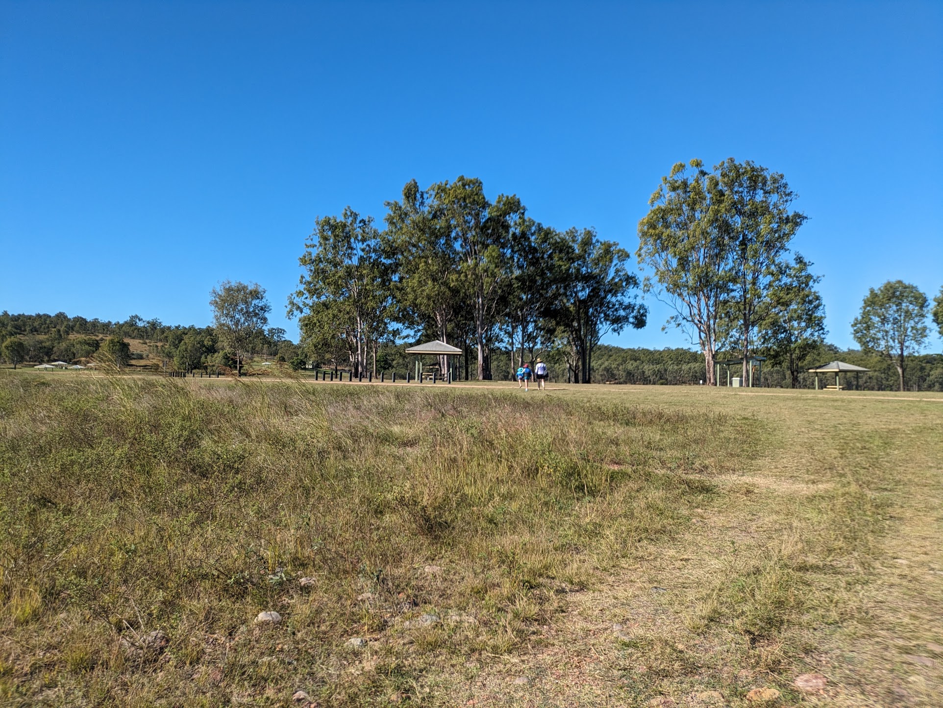 A photo of Michelle and the kids walking to a pagoda A photo of Michelle and the kids walking to a pagoda