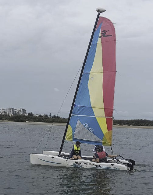 A photo of us four sailing a hobie catamaran. A photo of us four sailing a hobie catamaran.