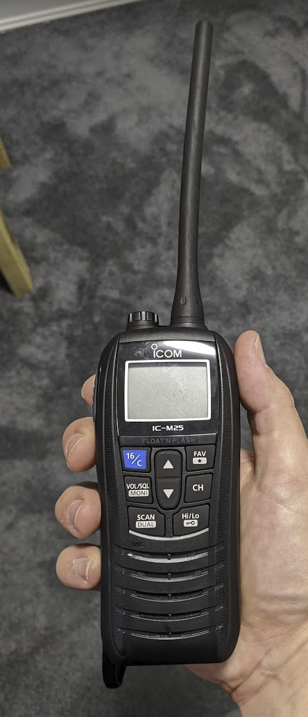 A photo of me holding an ICom IC-M25 radio. A photo of me holding an ICom IC-M25 radio.