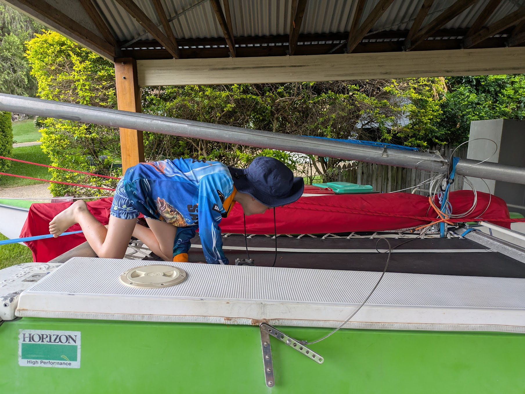 A photo of Sam on the trampoline of the boat at home