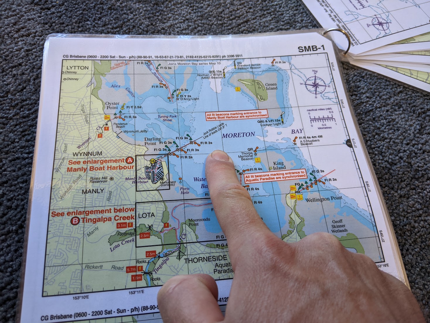 A photo of me pointing at "Moreton Bay" on a map.