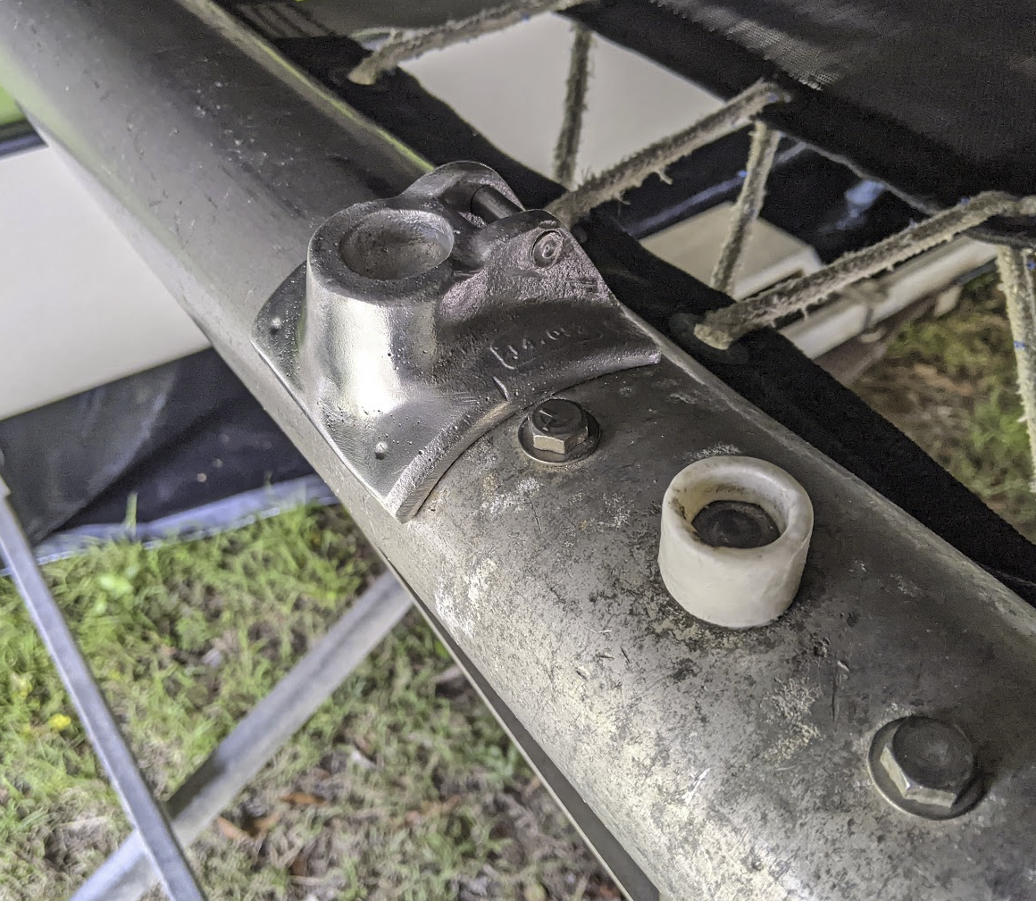 A photo of the mast step socket piece sitting next to the old mast step on the boat.