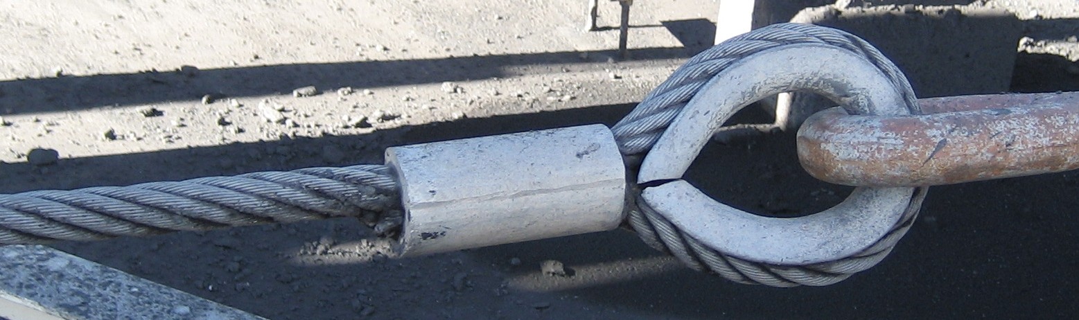 A photo of a swaged eye on the end of a thick steel cable